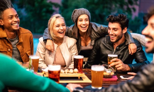 people smiling with drinks