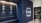 Neon sign of logo with blue wall in co-working space