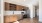 a kitchen with wooden cabinets