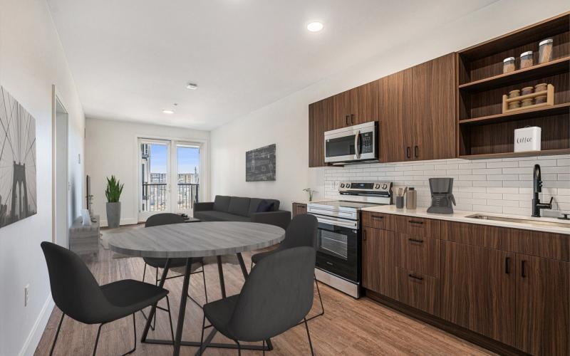 a kitchen with a dining table and chairs